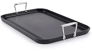 The image shows a collection of shiny nonstick pans, perfect for gas stove cooking.