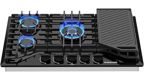 The image shows a sleek cooktop with a downdraft ventilation system integrated, perfect for any kitchen.