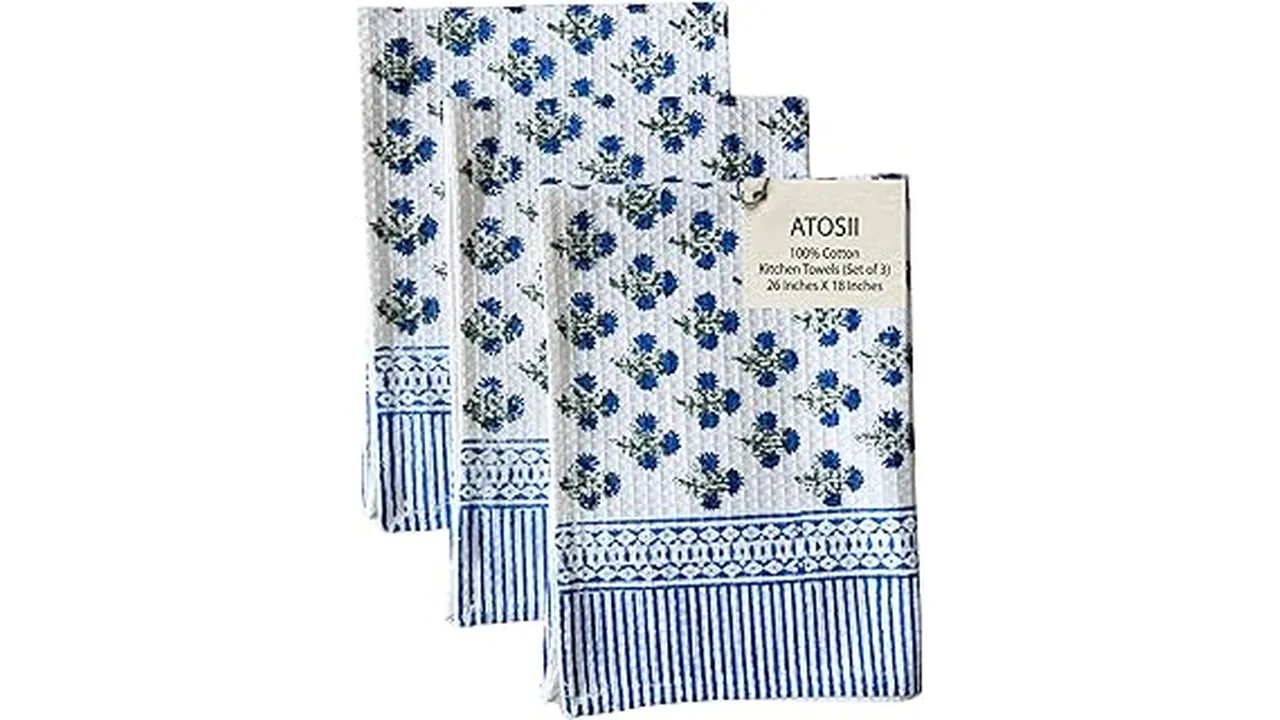The image shows a neatly folded stack of colorful kitchen hand towels, perfect for any busy cook.