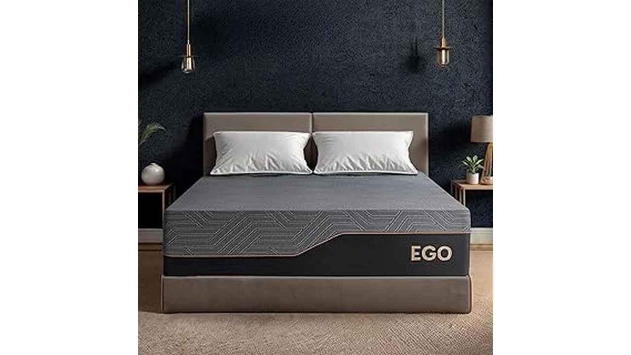 The image shows a neatly made bed with a plush mattress, perfect for long-lasting comfort and sleep.
