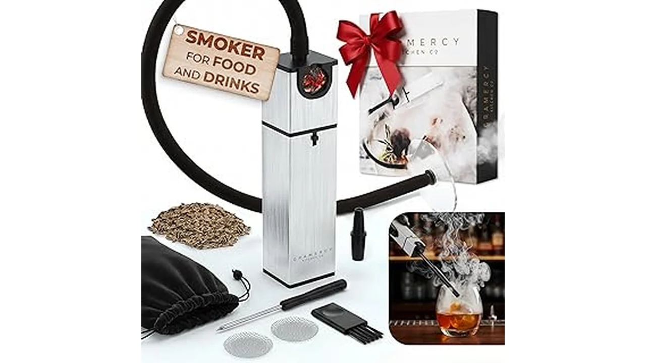The image shows a culinary smoking gun device with smoke emitting for food flavoring.